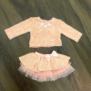 Authentic American Girl doll sweater and matching skirt outfit.